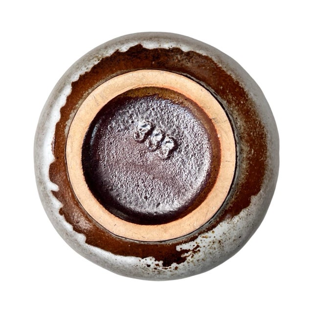 Ceramic vase in the Brussel style with mid-century modern elements produced in Germany in the 1970s for Jopeko Keramik....