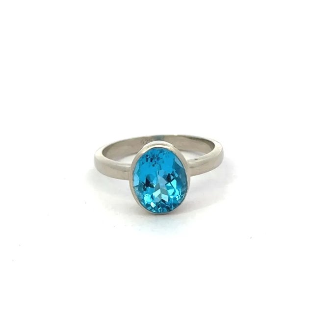 Blue 9x7 Mm Oval Cut Blue Topaz Silver Solitaire Ring by Carat&her - Size 8 For Sale - Image 8 of 12