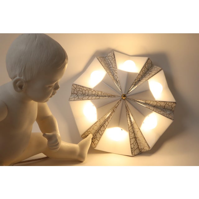 Star Wall Lamp in White and Gold Ceramic from Pan Keramik, Germany, 1970s, in Very Good conditions. Designed 1960 to 1969...
