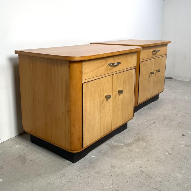 Nice set of beechwood bedside tables from Germany from the sixties. Each cabinet has two doors at the bottom with a drawer...