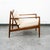 Solid walnut restored lounge chair with original off white oatmeal wool fabric cushions. New straps installed throughout...