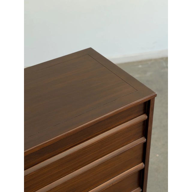 W48 D19 H35 A beautifully restored mid-century walnut dresser featuring a clean, architectural silhouette and six spacious...