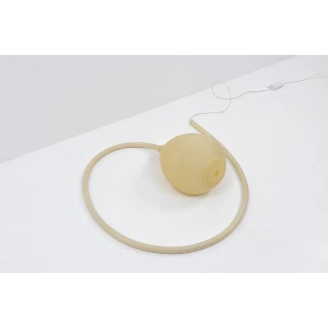 The silicone floor lamp has a dimmer installed, which can be activated by stepping on the stem of the lamp, which takes a...