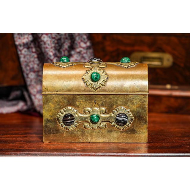 Step into the elegance of the late 19th century with this stunning Aesthetic Movement casket box, crafted circa 1880. This...