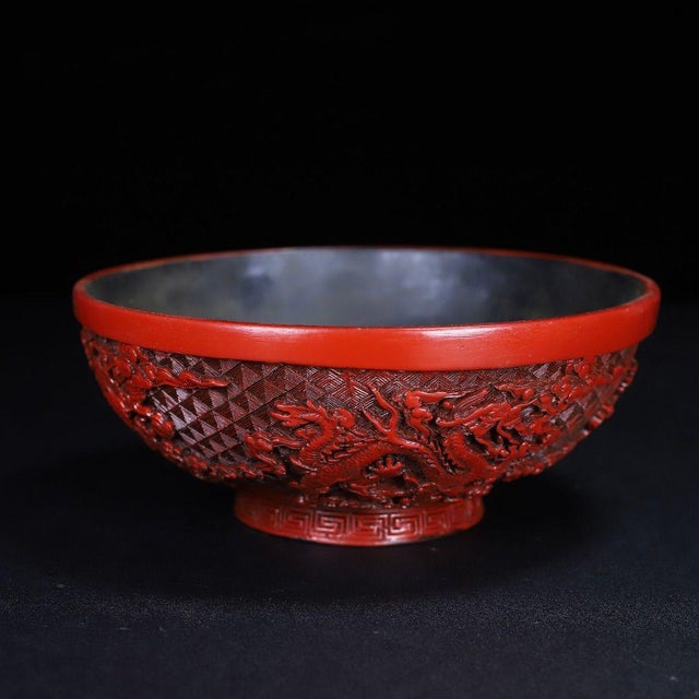 This magnificent vintage Chinese bowl is a stunning example of "Tixi" (carved red lacquer) craftsmanship. The bowl...