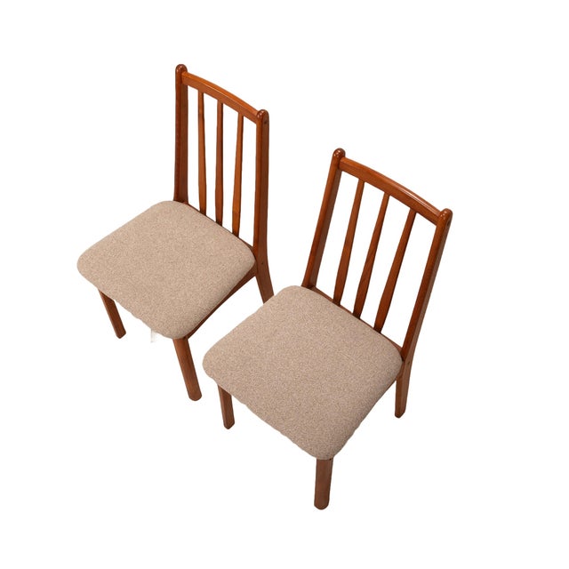 Here is a gorgeous pair of teak side chairs in the Danish Modern style, made by Koda Woodcraft Company. The chairs are in...