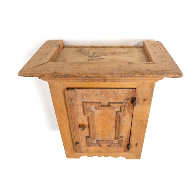 An authentic late 18th century Tyrolean pine wall cabinet, dating to circa 1775. This Alpine provincial piece features a...