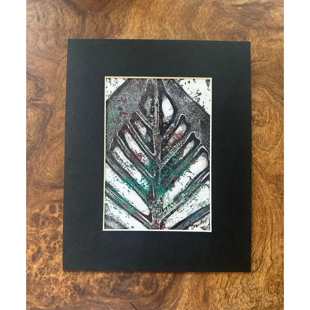 An original contemporary botanical abstraction inspired by the elegant structure of tropical foliage. Deep charcoal,...