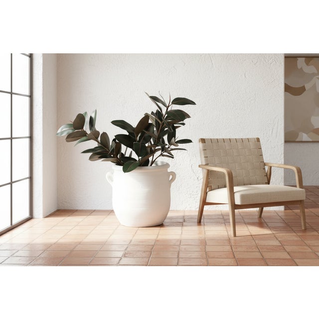 Evoking the sun-baked simplicity of the Greek Isles or Southern Italy, this large vessel focuses on texture and organic...