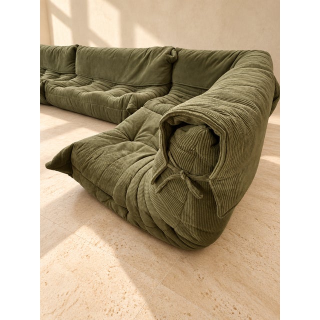 This Togo modular sofa by Michel Ducaroy for Ligne Roset, dating to the 1970s, features rich olive green corduroy...
