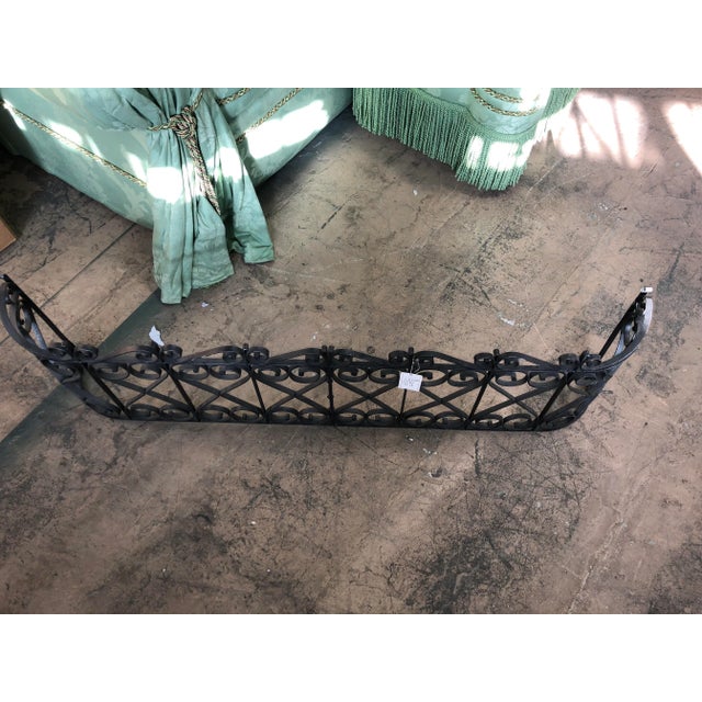 Large scrolled iron fire front. Old world reproduction fire-screen will add charm to your hearth and fireplace.