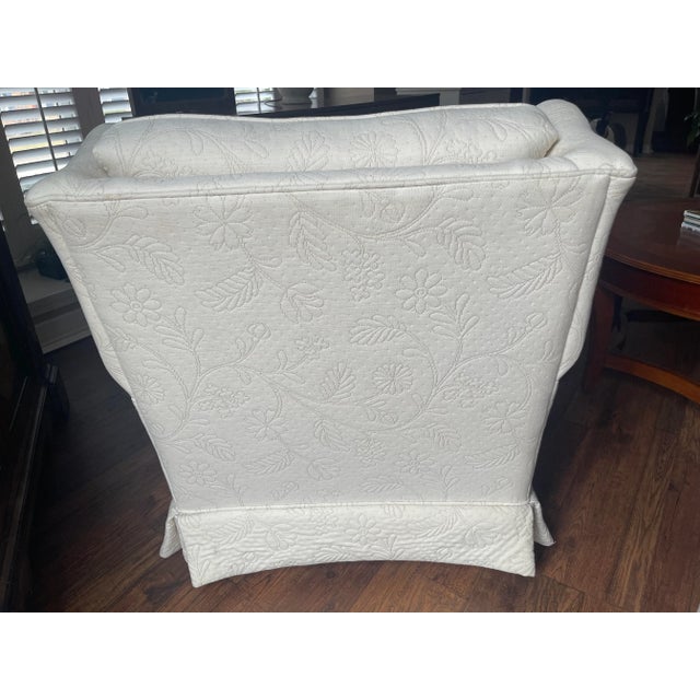 Beautiful Ethan Allen upholstered cream colored chair with delicate flower embroidery.