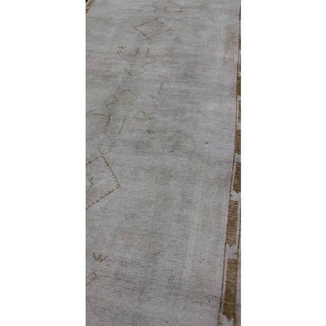 Mid 20th Century Muted Vintage Turkish Oushak Runner a Faint Tribal Design For Sale - Image 5 of 12