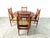 Elegant mid century scandinavian dining set consisting of 4 spindle chairs and a round dining table. The chairs and table...