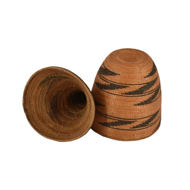 The Tutsi Tight Weave Basket with Lid from Rwanda epitomizes the artistry and tradition of the Tutsi community's weaving...