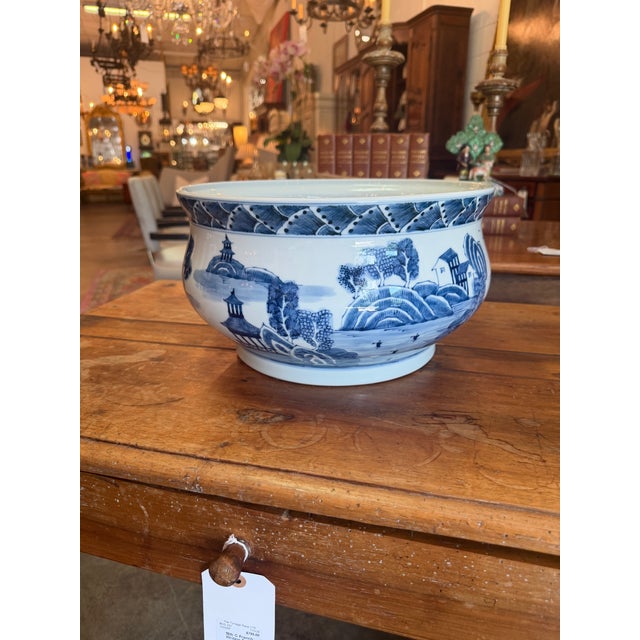 An elegant contemporary Chinoiserie blue and white porcelain centerpiece bowl by the luxury home decor brand Port 68....