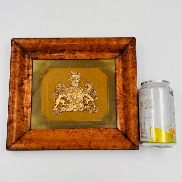 A distinguished early to mid-century framed English Royal Coat of Arms, beautifully presented in a richly figured burlwood...
