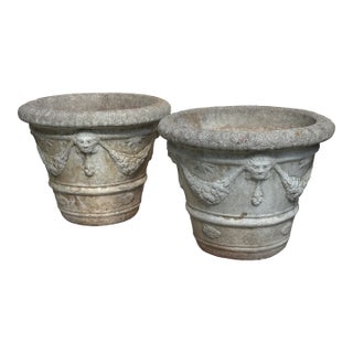 Mid 20th Century Pair of Neoclassical Cast Stone Garden Urns With Mask and Garland Motifs For Sale