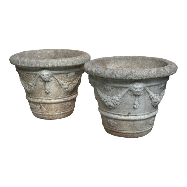 Mid 20th Century Pair of Neoclassical Cast Stone Garden Urns With Mask and Garland Motifs For Sale