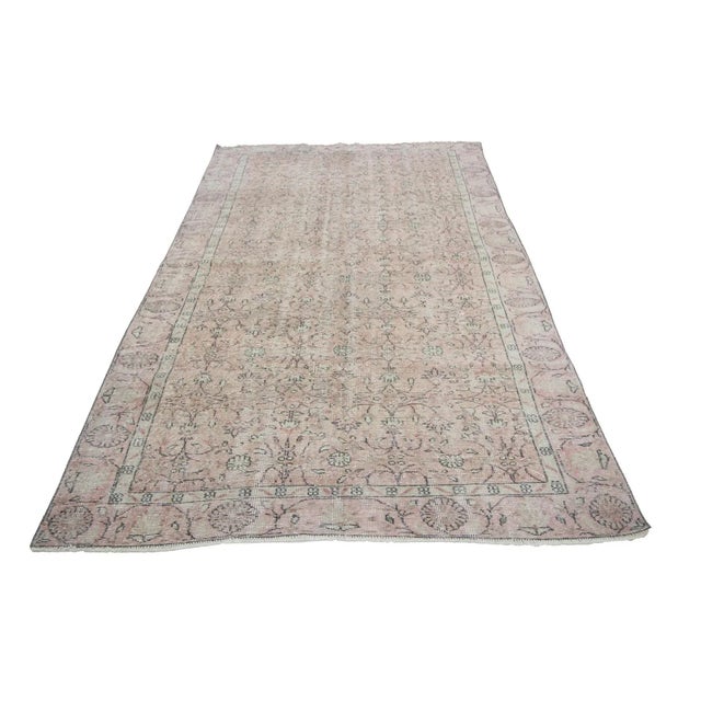 Washed out vintage handknotted rug from Oushak region of Turkey. Approximately 50-60 years old. In very good condition