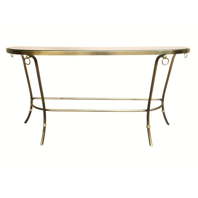 A brushed nickel and glass console table with brass accents by Design Institute of America. The demilune glass sits...