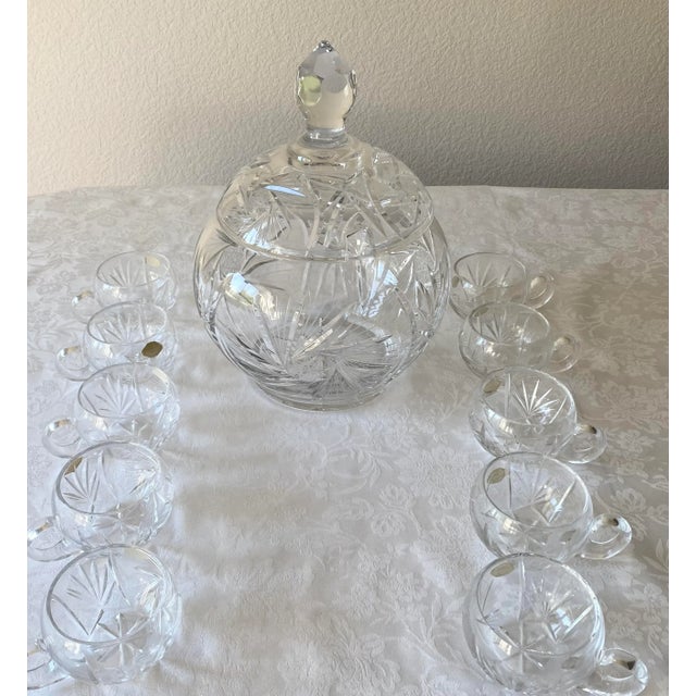 Mid 20th Century Exquisitely Stunning Hand Cut Crystal Covered Punch Bowl and 10 Hand Cut Crystal Cups. The mid 20th...