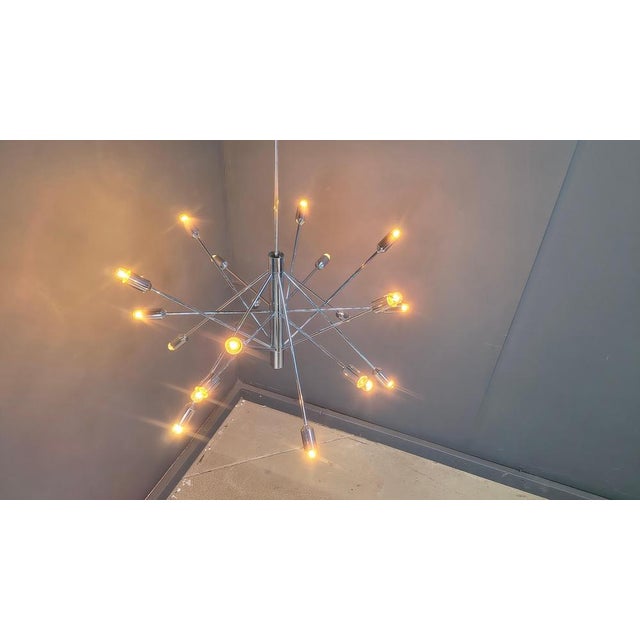 Chromed sputnik style chandelier with 18 lightpoints Beautiful, striking chandelier which emits a very nice diffuse light...