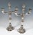 Two festive Biedermeier silver candleholders on a four-pass, cambered stand with curved rim, chased and chiselled rose...