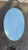 Vintage 1960s oval mirror, has a sign of use due to the time.