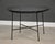 A mid century round dining table with a glass top designed by Arthur Umanoff. Glass has some scratches but no chips. Circa...