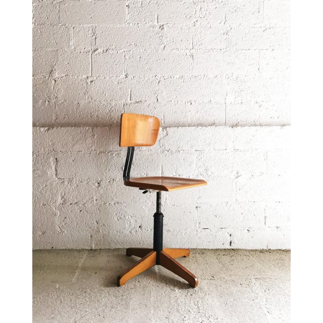 This minimalist swivel chair, "Ama-Elastik," dates back to the 1950s and served for many years in an architect's office....
