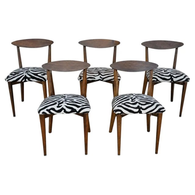 One dining chair in the manner of Kurt Ostervig Danish modern solid wood in a walnut finish in the style of Kurt Ostervig....