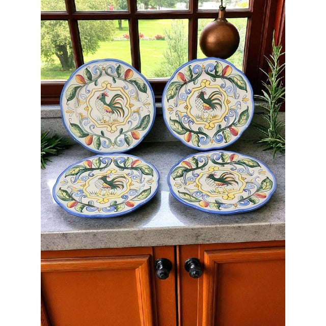 The Fitz & Floyd hand-painted "Ricamo" rooster salad dessert luncheon plates are a charming addition to any table setting....