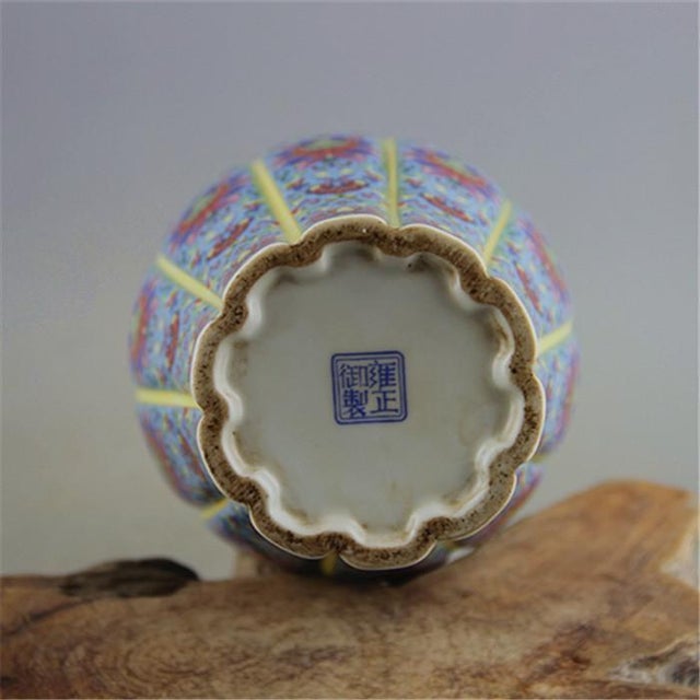 This vibrant ceramic vase is a striking decorative piece that brings a touch of ornate elegance to any space. The vase...