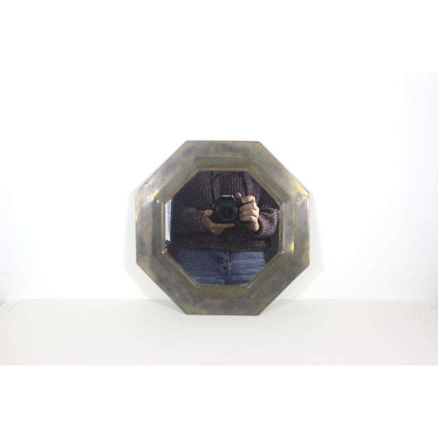 Vintage mid century modern octagonal Moroccan brass mirror. This has gorgeous heavy patina on the brass with mild bumps...