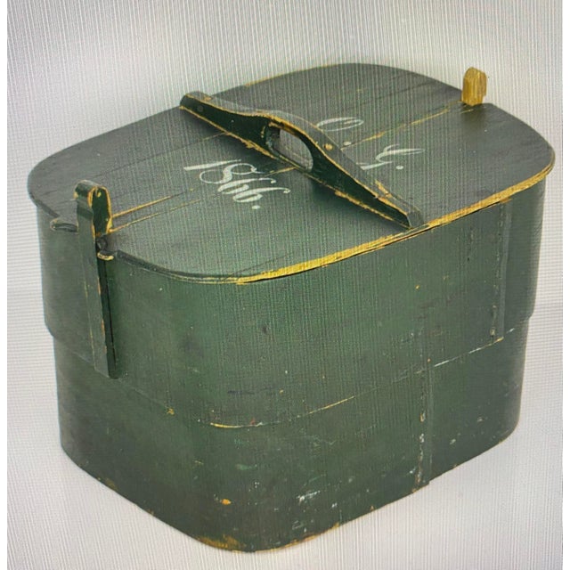 An allmoge in the shape of an antique Swedish box. This box is made of painted wood in a rare shape. with the monogram of...