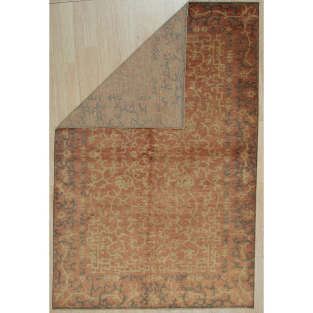 Lydia Jasmine Coral Hand Knotted Wool Rug, Country of Origin: China. This exquisite piece reflects the enduring legacy of...