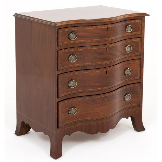 Mahogany Serpentine chest of drawers with hepplewhite influences. Standing on splay feet with a very pretty shaped apron....