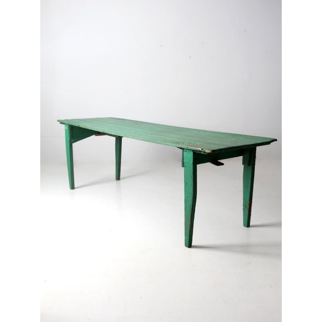 This antique hand crafted folding table dates to the 1920s and was originally built by its owner as an outdoor dining...