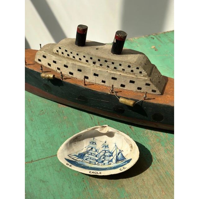 Vintage Folk Art Hand-Painted "US Eagle C.G." Clam Shell, Circa 1950s. Natural half clamshell with a hand-painted ship on...