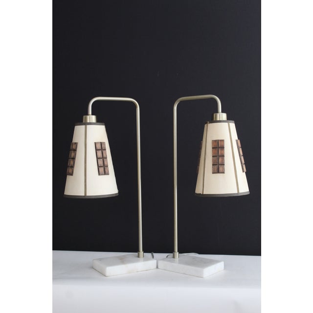 A pair off Gerald Thurston style table lamps. Hand made parchment shades with walnut trim. mounted on brushed brass and...
