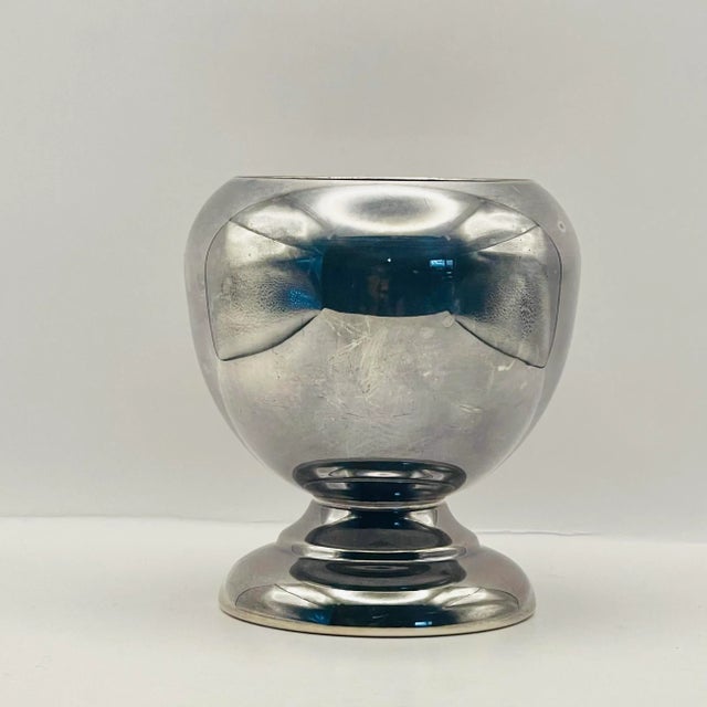 A simple and elegant silver-plate small bowl that would be striking filled with flowers, pens, toothbrushes or almost...