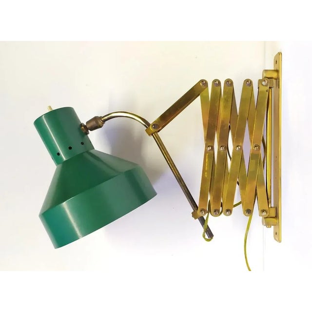 This green wall brass light was produced in Italy around the 1940s. Very good vintage condition. Original green color....