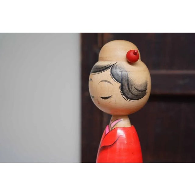 Elegant vintage kokeshi crafted by the renowned Hajime Miyashita. This kokeshi features a subtly painted face and...