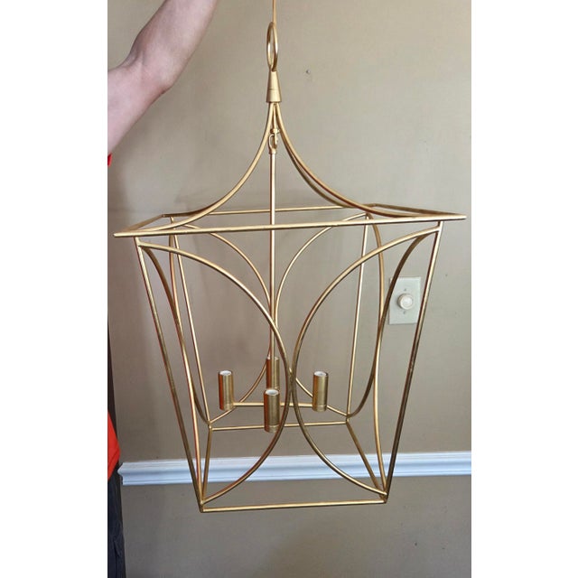 This gorgeous statement fixture is a chic and modern take on the traditional lantern! Gilt finish, dimensions are 32"H x...