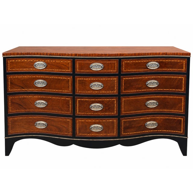 A striking vintage dresser by Heritage Henredon, retaining its branded maker’s mark inside the drawer. This elegant piece...