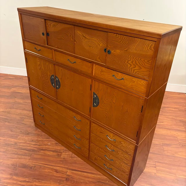 Impressive vintage Japanese tansu chest dating to the 1980s, combining abundant storage with beautifully figured wood and...
