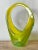 This exceptional piece of vintage art glass embodies the vibrant aesthetic and fluid, organic forms characteristic of...