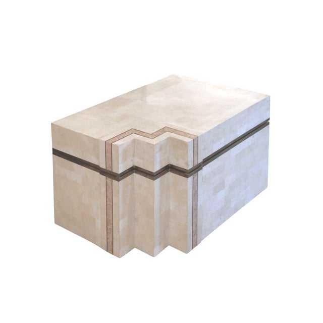 A post modern chest with an unusual geometric shape. The wooden frame is decorated with tessellated honed and filled...