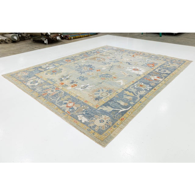 This exquisite hand-knotted wool rug reimagines the timeless elegance of Sultanabad design for the modern home. Featuring...